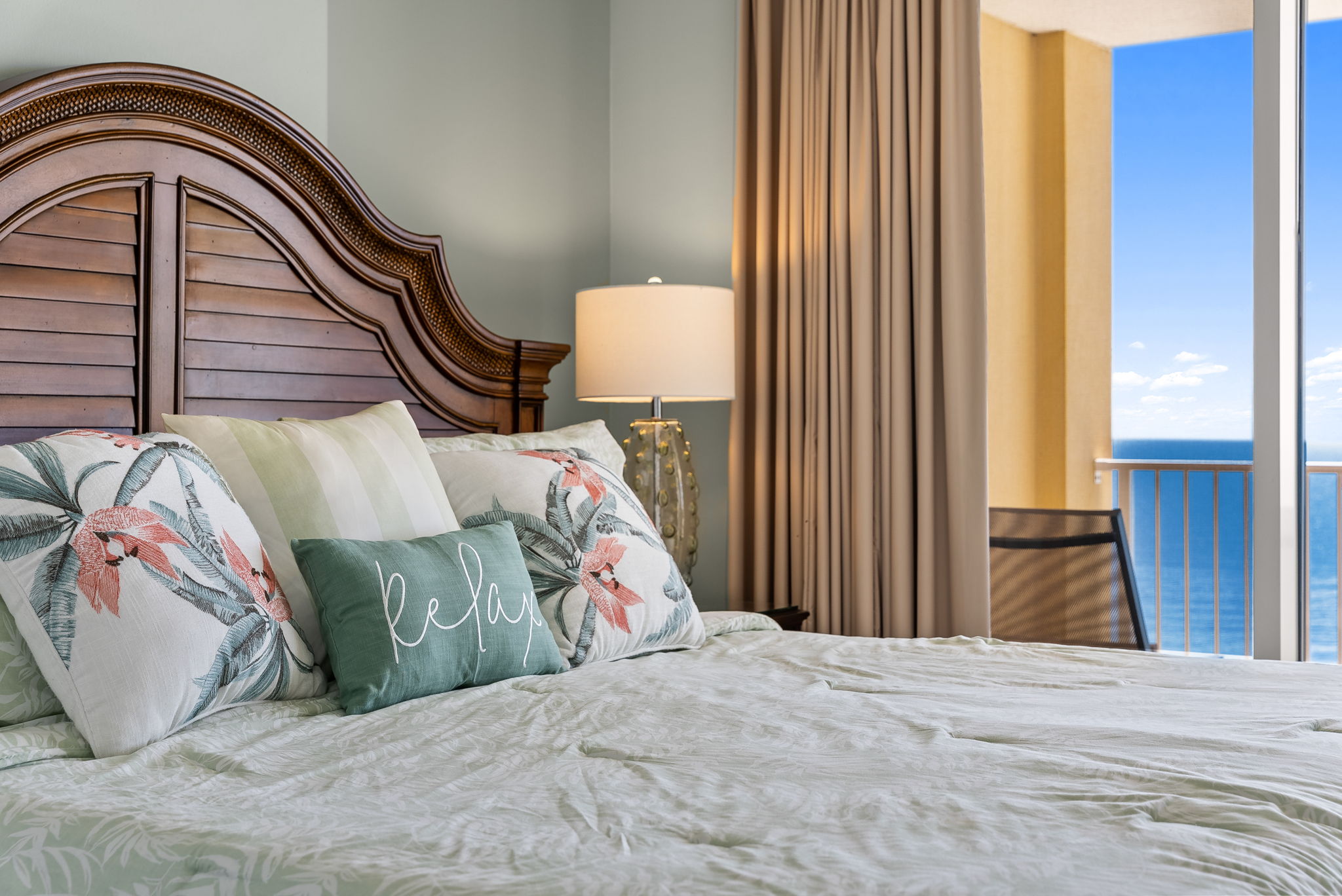 Primary bedroom with soft linens and natural light